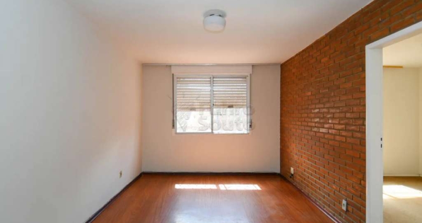 Apartamento de 1 Dormitório no Edifício Dona Tereza: Conforto e Iluminação no Centro