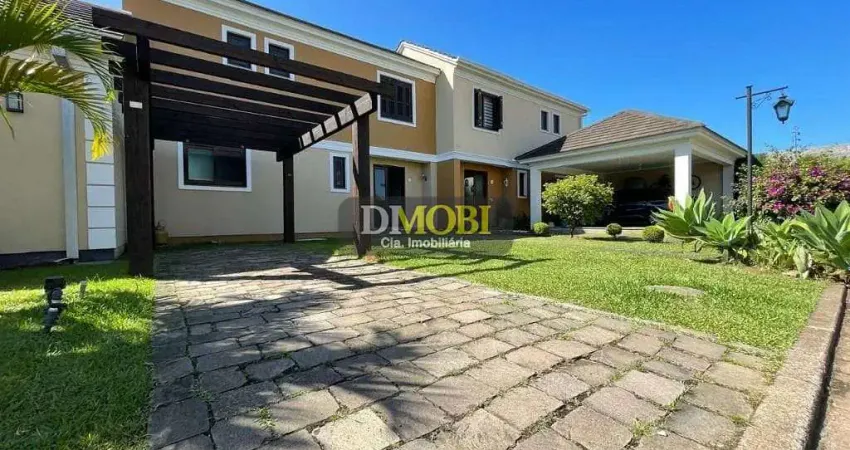 Sobrado com 3 dormitórios para alugar, 107 m² por R$ 4.691,00/mês - Reserva do Arvoredo - Gravataí/