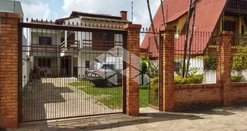 Casa com 7 quartos à venda na Rua General Telino Chagastelles, 75, Parque Santa Fé, Porto Alegre
