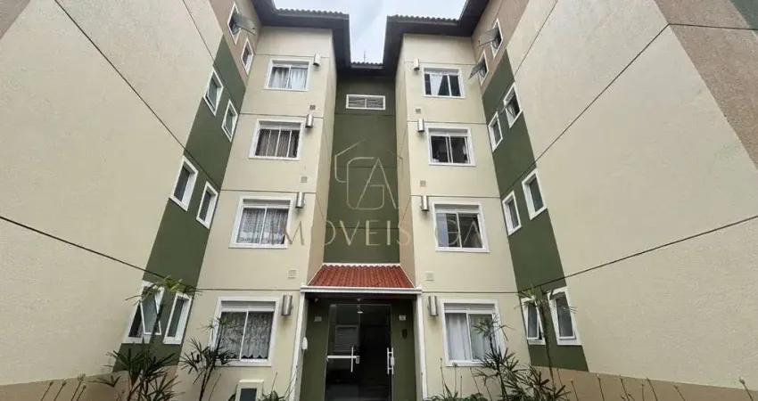 Apartamento semimobiliado com suíte, sacada com churrasqueira e garagem coberta