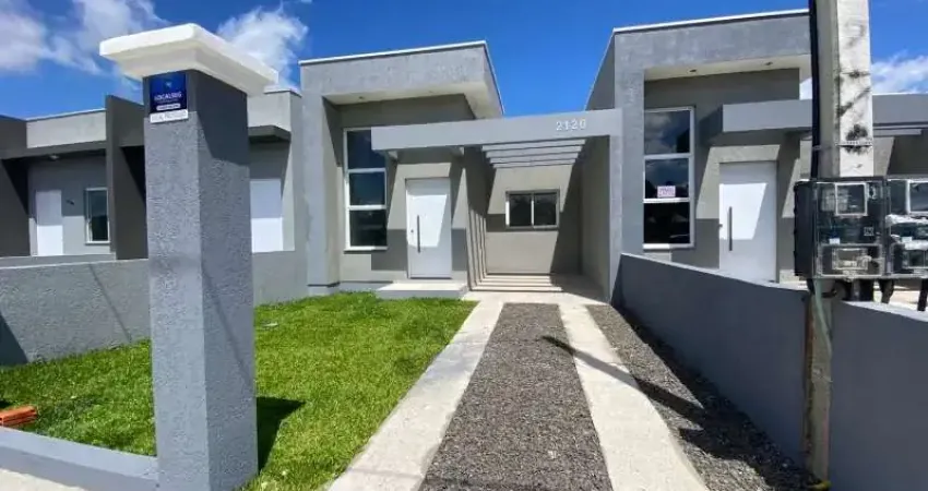 Venda de linda casa geminada, 2 dormitórios, pé direito alto, alto padrão construtivo em nova tramandaí.