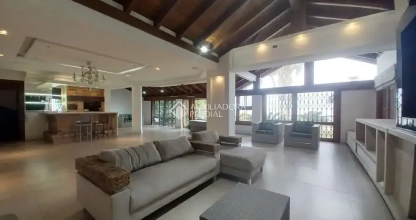 Casa em condomínio fechado com 3 quartos para alugar na Avenida Coronel Marcos, 899, Pedra Redonda, Porto Alegre