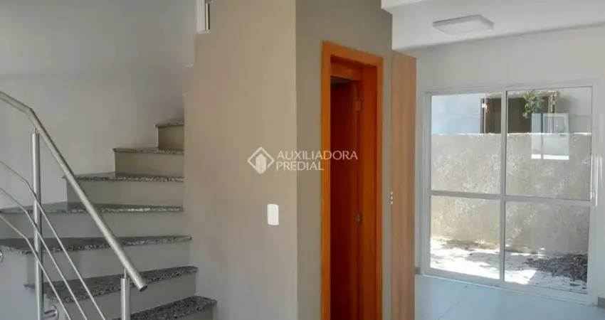 Casa em condomínio fechado com 2 quartos para alugar na Rua Miguel Ascoleze, 125, Vila Nova, Porto Alegre