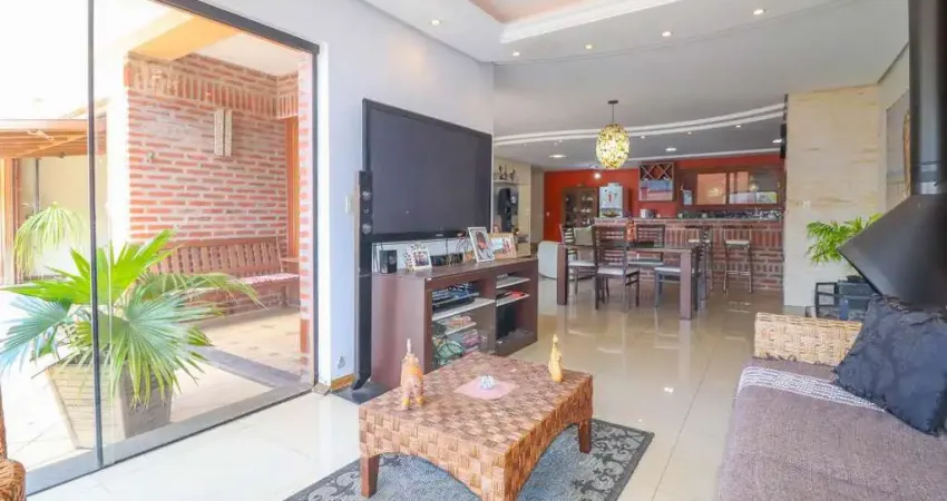 Casa térrea com 4 dormitórios, sendo 02 suítes, pátio com piscina. bairro bela vista - canoas.