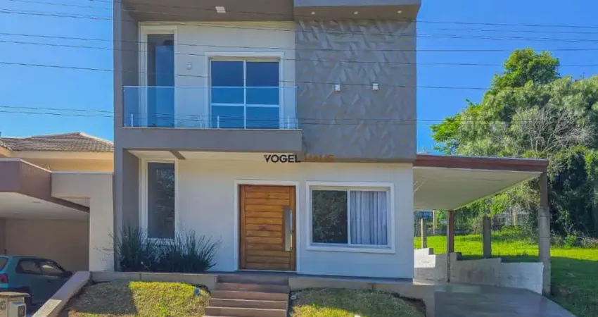 Casa ampla em excelente condomínio fechado em gravataí, na luigi lucchese, loteamento jardim timbaúva, com pátio de quase 200m² e 150m² de área construída.