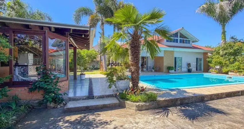 Casa térrea com piscina e terreno 24x30m no bairro igara, canoas - venda