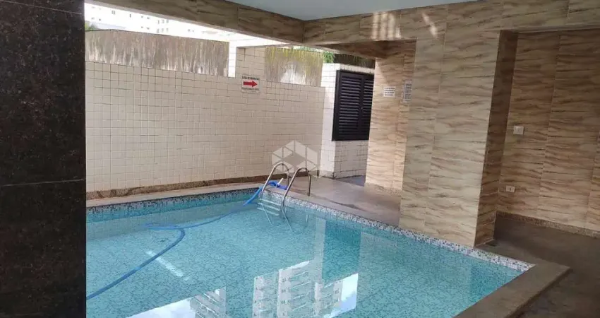 apartamento a venda na praia grande, bairro caiçara, repasse de financiamento com 2 quaros, 2 suites e 1 vaga