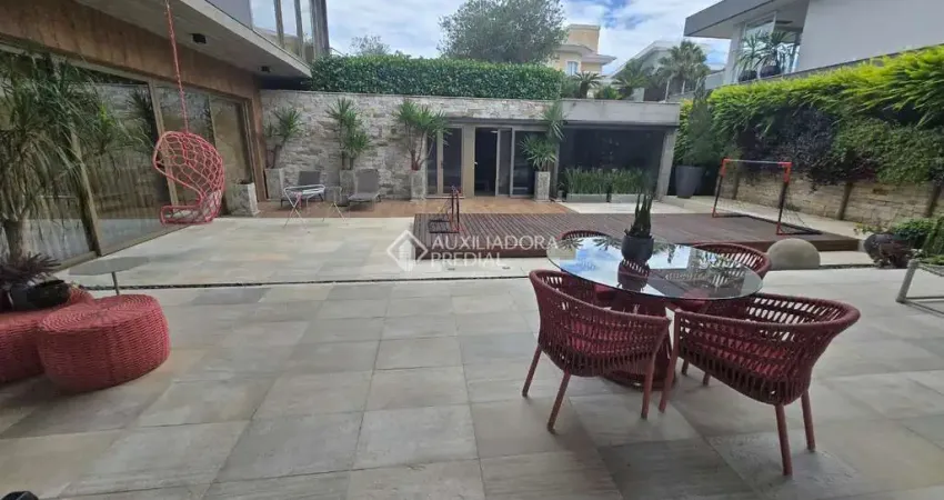 Casa em condomínio fechado com 4 quartos à venda na Rodovia Haroldo Soares Glavan, 1760, Cacupé, Florianópolis