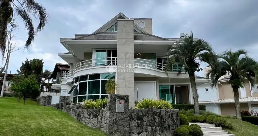 Casa em condomínio fechado com 4 quartos à venda na Rodovia Haroldo Soares Glavan, 929, Cacupé, Florianópolis