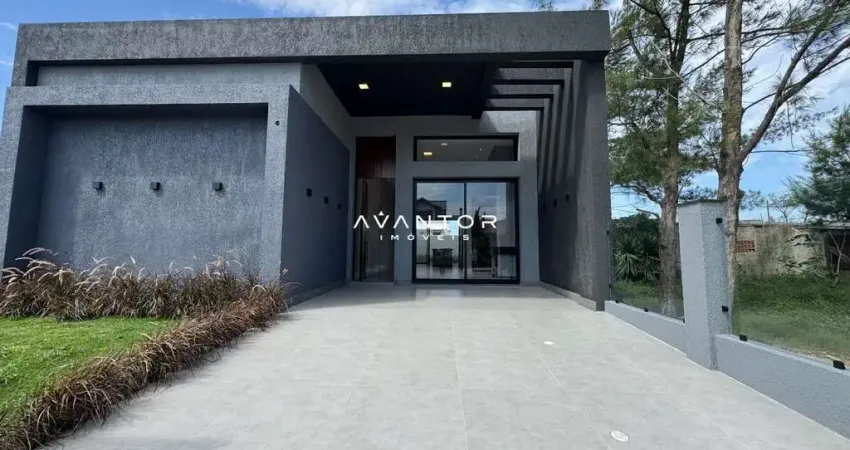 Casa de 4 dormitórios, com jardim interno e 2 vagas garagem, em Xangrilá (RS)