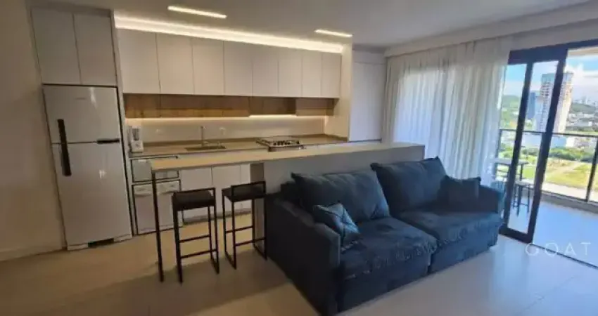 Apartamento em home club completo na praia brava com vista parcial do mar