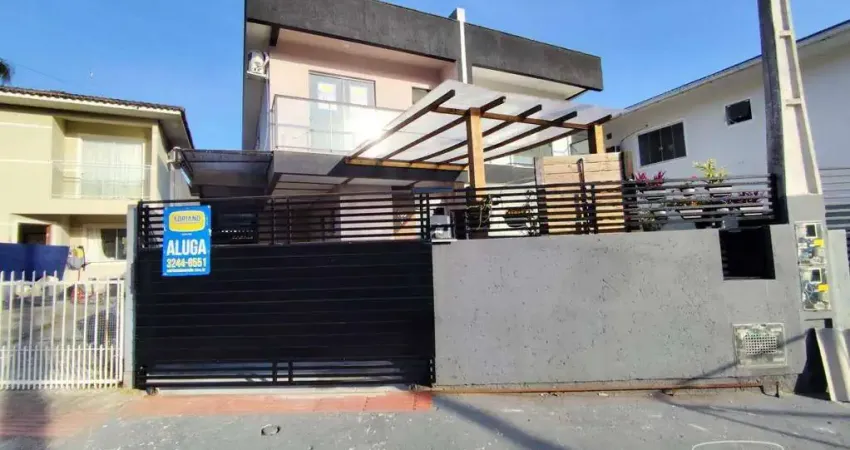 Casa com 3 dormitórios para alugar, 128 m² por R$ 3.356,49/mês - Potecas - São José/SC