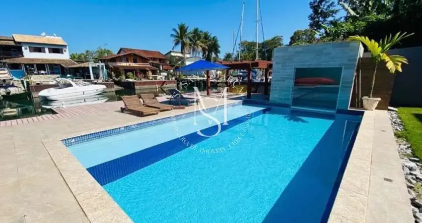 Casa de canal à venda e temporada no porto bracuhy – 5 suítes e sofisticação à beira-mar