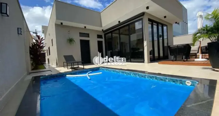 Casa em condomínio com 3 suítes no bairro laranjeiras em uberlândia - mg.