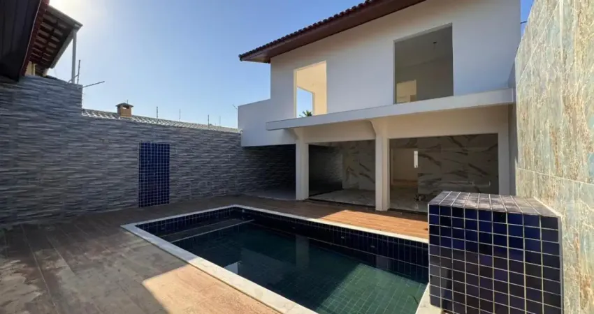 Casa localizada proxima a praia a 500 metros do mar com 4 quartos e area gourmet com churrasqueira e piscina