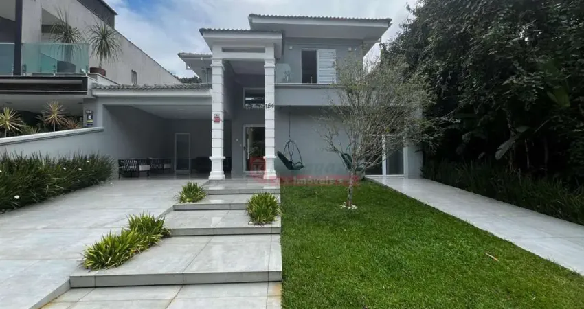 Casa com 4 suítes à venda, 240 m² por R$ 5.000.000 - Riviera Módulo 26 - Bertioga/SP