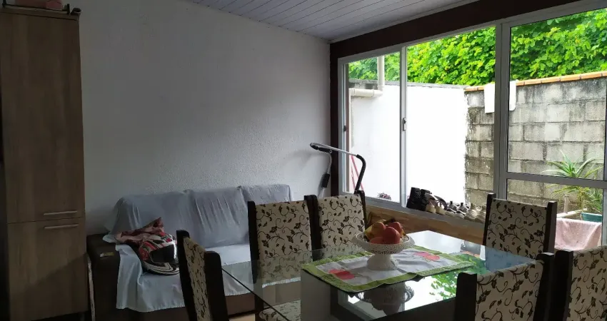 Casa a venda em condomínio fechado de 02 dormitórios com vaga de garagem coberta no bairro bela vista em palhoça-sc