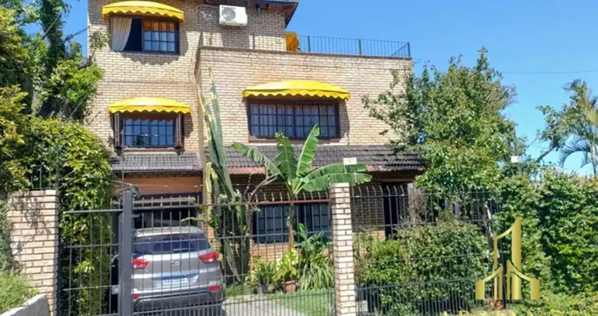Casa com 4 quartos à venda na Rua Arapei, 325, Cristal, Porto Alegre