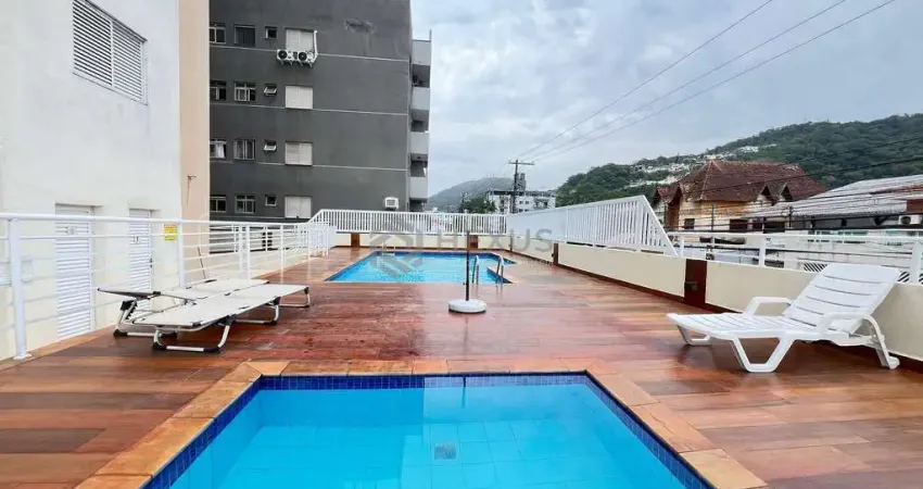 Apartamento com varanda e lazer na praia da enseada, guaruja