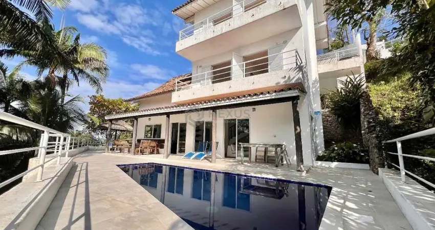 Casa frente mar com piscina e área gourmet no condomínio península na praia da enseada, guaruja