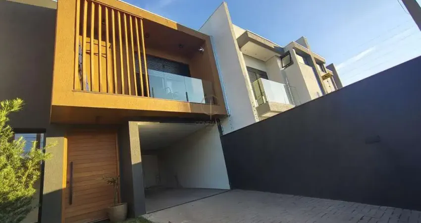 Sobrado 03 dormitórios, sendo 01 suíte e closet, piso aquecido nos banheiros e persianas automatizadas 02 vagas para veículos, no bairro igara