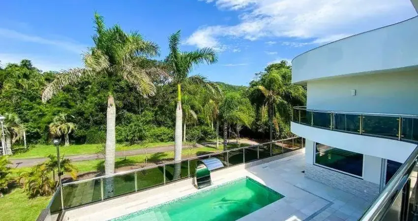 Casa em condomínio fechado com 5 quartos à venda na Rua das Caraúnas, Jurerê Internacional, Florianópolis