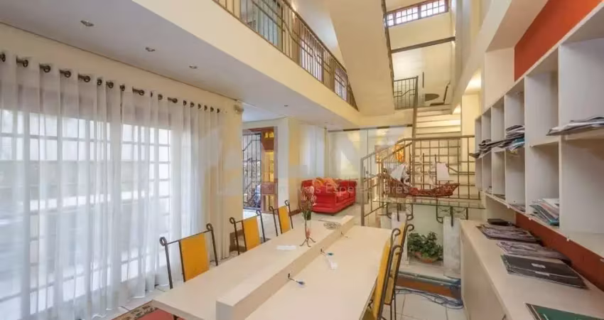 Casa semimobiliada com 5 quartos sendo 1 suíte e 3 vagas de garagem à venda no bairro higienópolis em porto alegre