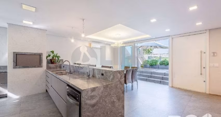 Casa alto padrão 3 dormitórios 3 suítes e 3 vagas à venda no bairro Três Figueiras em Porto Alegre