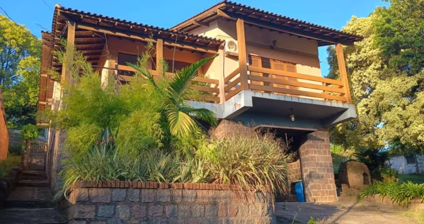 Casa com 3 quartos à venda na Avenida Vicente Monteggia, 2486, Cavalhada, Porto Alegre