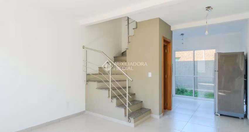 Casa em condomínio fechado com 2 quartos à venda na Rua Miguel Ascoleze, 125, Vila Nova, Porto Alegre