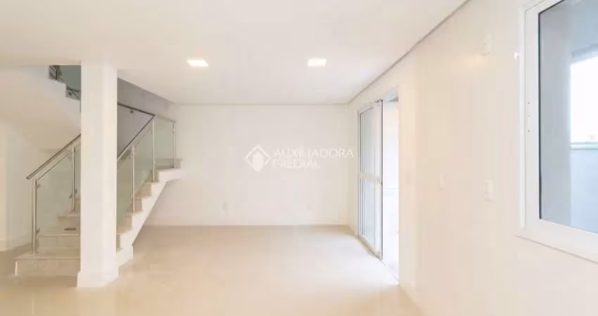 Casa em condomínio fechado com 3 quartos para alugar na Rua Jean Vardaramatos, 130, Hípica, Porto Alegre