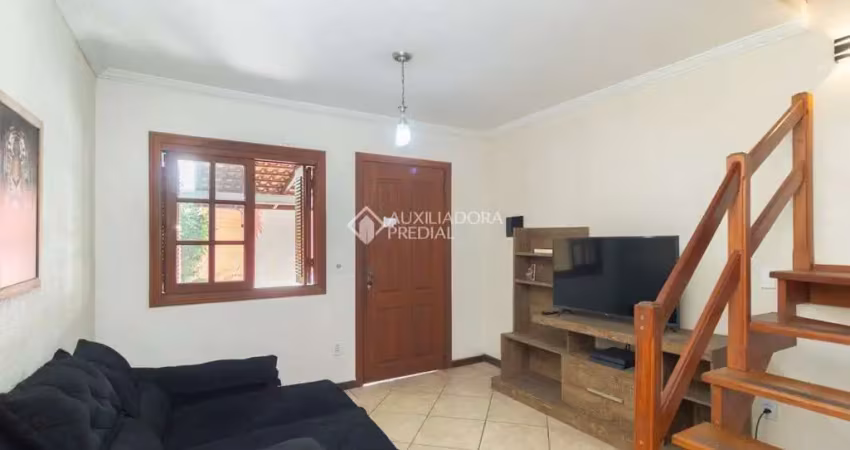 Casa em condomínio fechado com 3 quartos para alugar na Rua Sílvio Silveira Soares, 2406, Camaquã, Porto Alegre