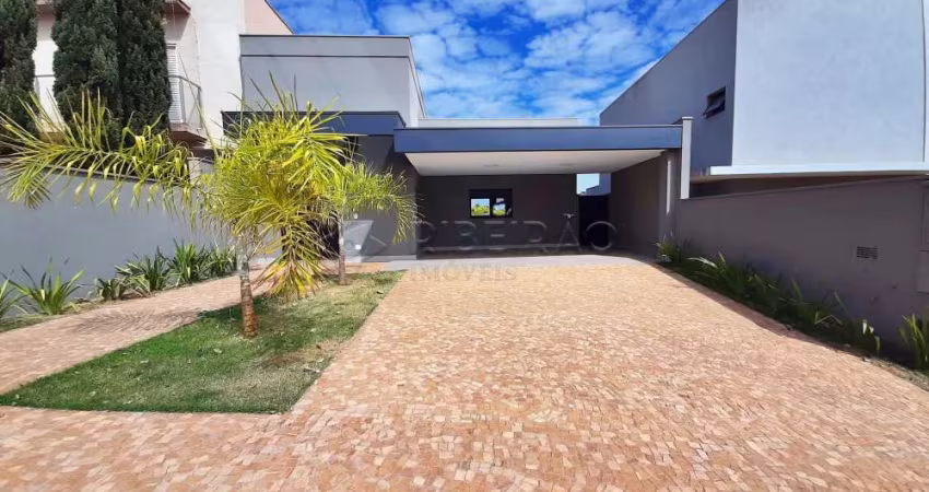 Casa térrea em condomínio no Bairro Vista Bella com  03 suítes, armários planejados, piscina varanda gourmet com churrasqueira.
