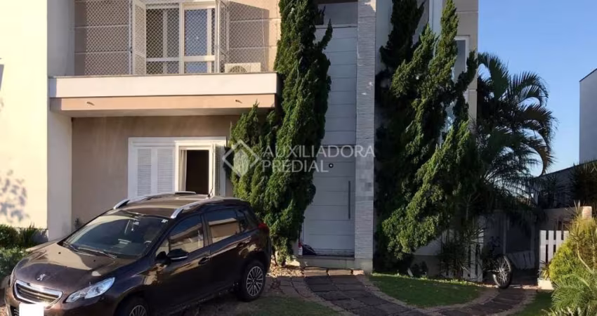 Casa em condomínio fechado com 4 quartos à venda na Avenida Edgar Pires de Castro, 540, Campo Novo, Porto Alegre