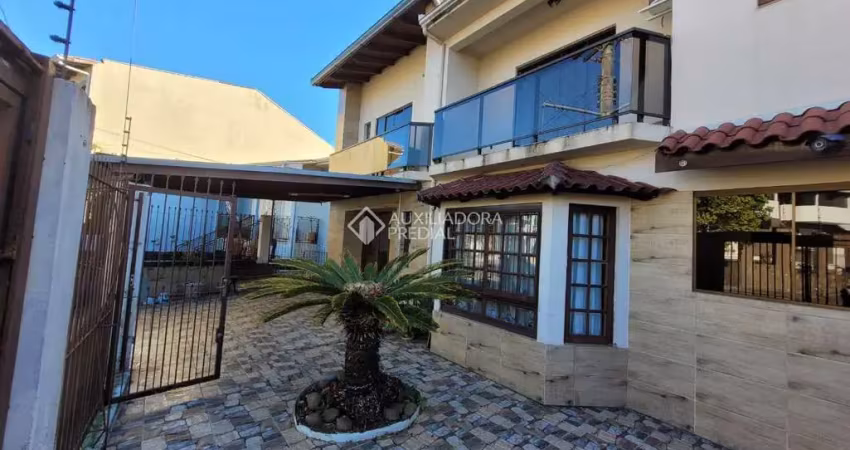 Casa com 4 quartos à venda na Rua Sol Nascente, 34, Lomba do Pinheiro, Porto Alegre