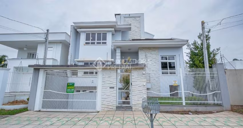 Casa com 5 quartos à venda na Rua País de Gales, 137, Marechal Rondon, Canoas