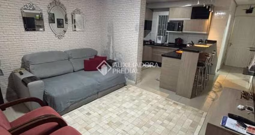 Casa com 2 quartos à venda na Rua Biguás, 481, Jardim Algarve, Alvorada