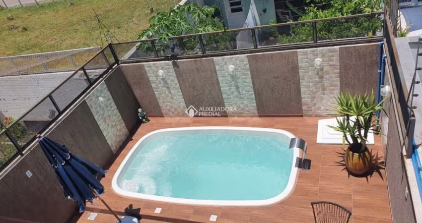 Casa em condomínio fechado com 3 quartos à venda na Rua Aldo Sani, 164, Hípica, Porto Alegre