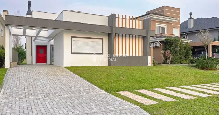 Casa em condomínio fechado com 3 quartos à venda na Avenida Juca Batista, 9000, Belém Novo, Porto Alegre