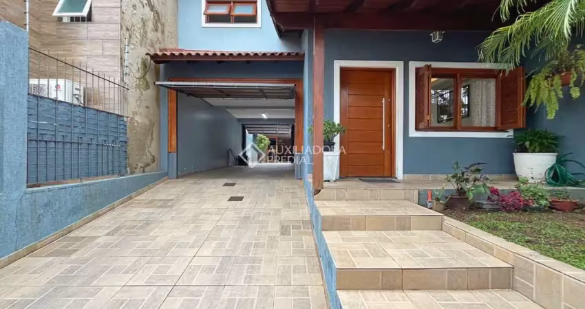 Casa em condomínio fechado com 3 quartos à venda na Rua Sargento Bruno Feldmann, 80, Guarujá, Porto Alegre