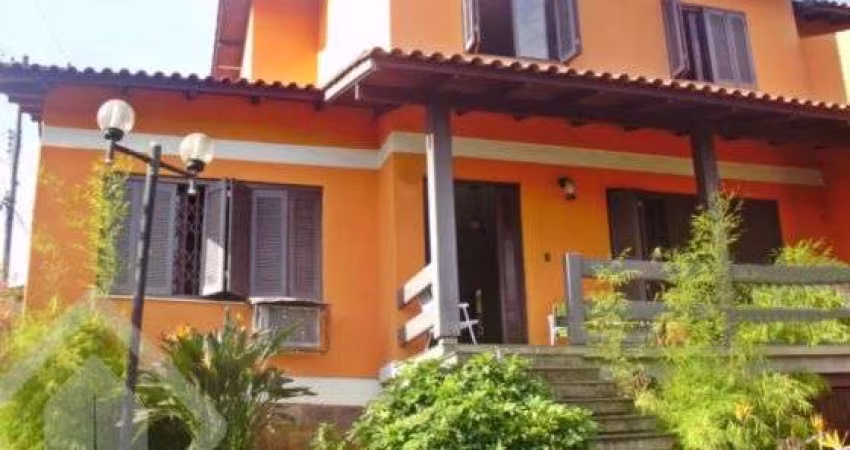 Casa em condomínio fechado com 5 quartos à venda na Rua Ângelo Passuelo, 79, Vila Nova, Porto Alegre