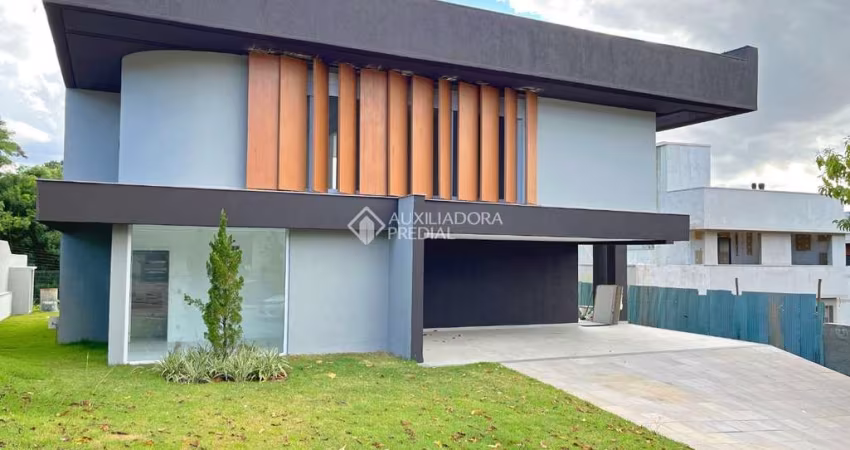 Casa em condomínio fechado com 4 quartos à venda na Estrada das Três Meninas, 2000, Vila Nova, Porto Alegre