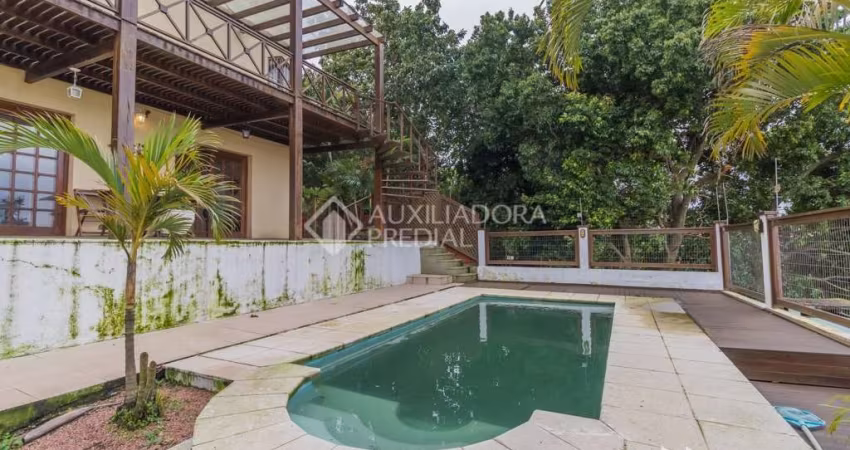 Casa com 4 quartos à venda na Rua Chiriguano, 265, Vila Assunção, Porto Alegre