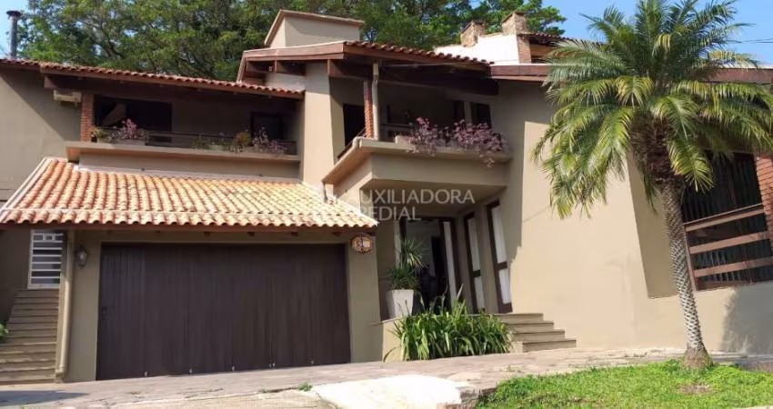 Casa em condomínio fechado com 3 quartos à venda na Rua Edgar Luiz Schneider, 510, Jardim Isabel, Porto Alegre