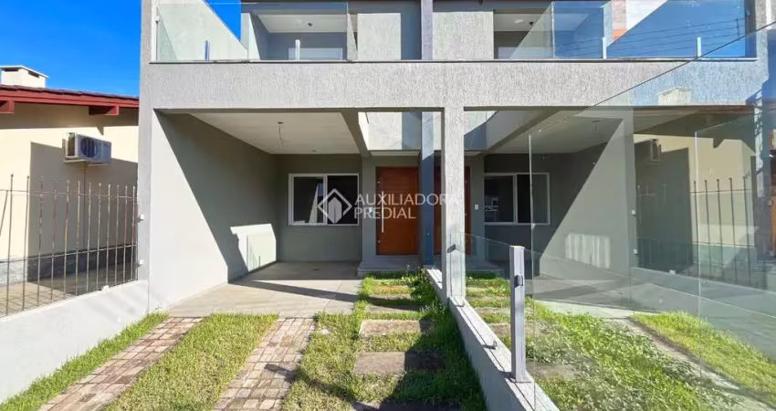 Casa em condomínio fechado com 3 quartos à venda na Rua Itacyr Rossi, 31, Guarujá, Porto Alegre