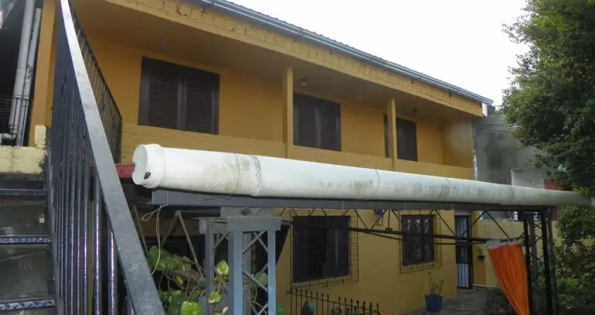 Casa com 3 quartos à venda na Avenida Monte Cristo, 515, Vila Nova, Porto Alegre