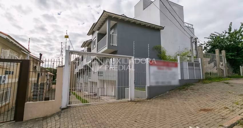 Casa em condomínio fechado com 3 quartos à venda na Rua Padre João Batista Reus, 2754, Camaquã, Porto Alegre