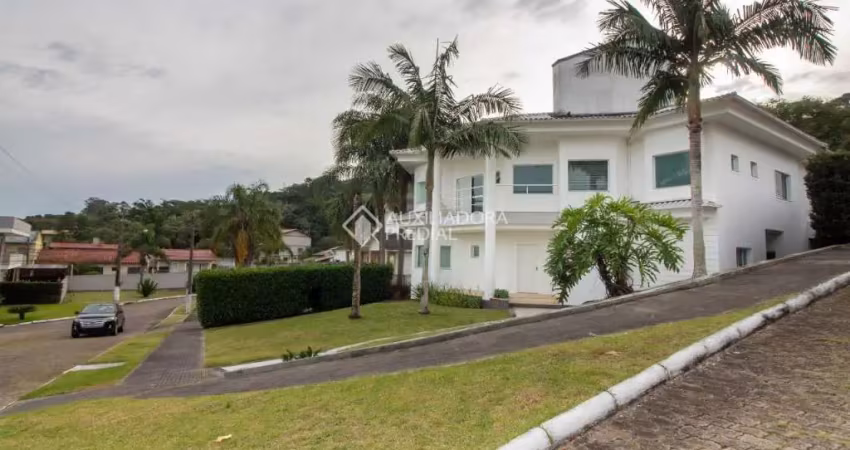 Casa em condomínio fechado com 4 quartos à venda na Rodovia Haroldo Soares Glavan, 929, Cacupé, Florianópolis