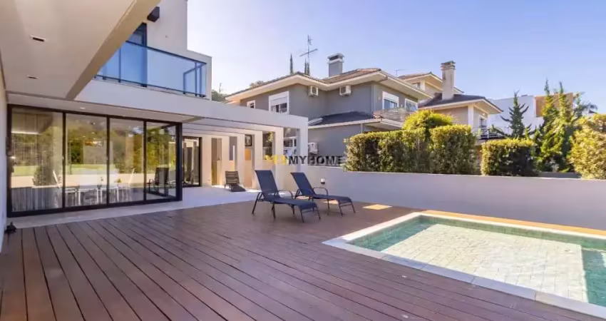 Casa em condomínio luxuoso com 4 suítes, sendo 1 no piso térreo! piscina aquecid