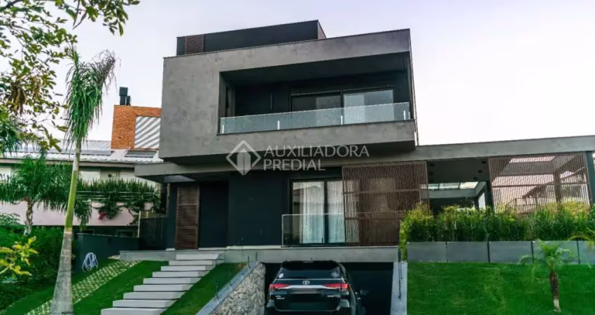 Casa em condomínio fechado com 5 quartos à venda na Rodovia Doutor Antônio Luiz Moura Gonzaga, 3801, Rio Tavares, Florianópolis